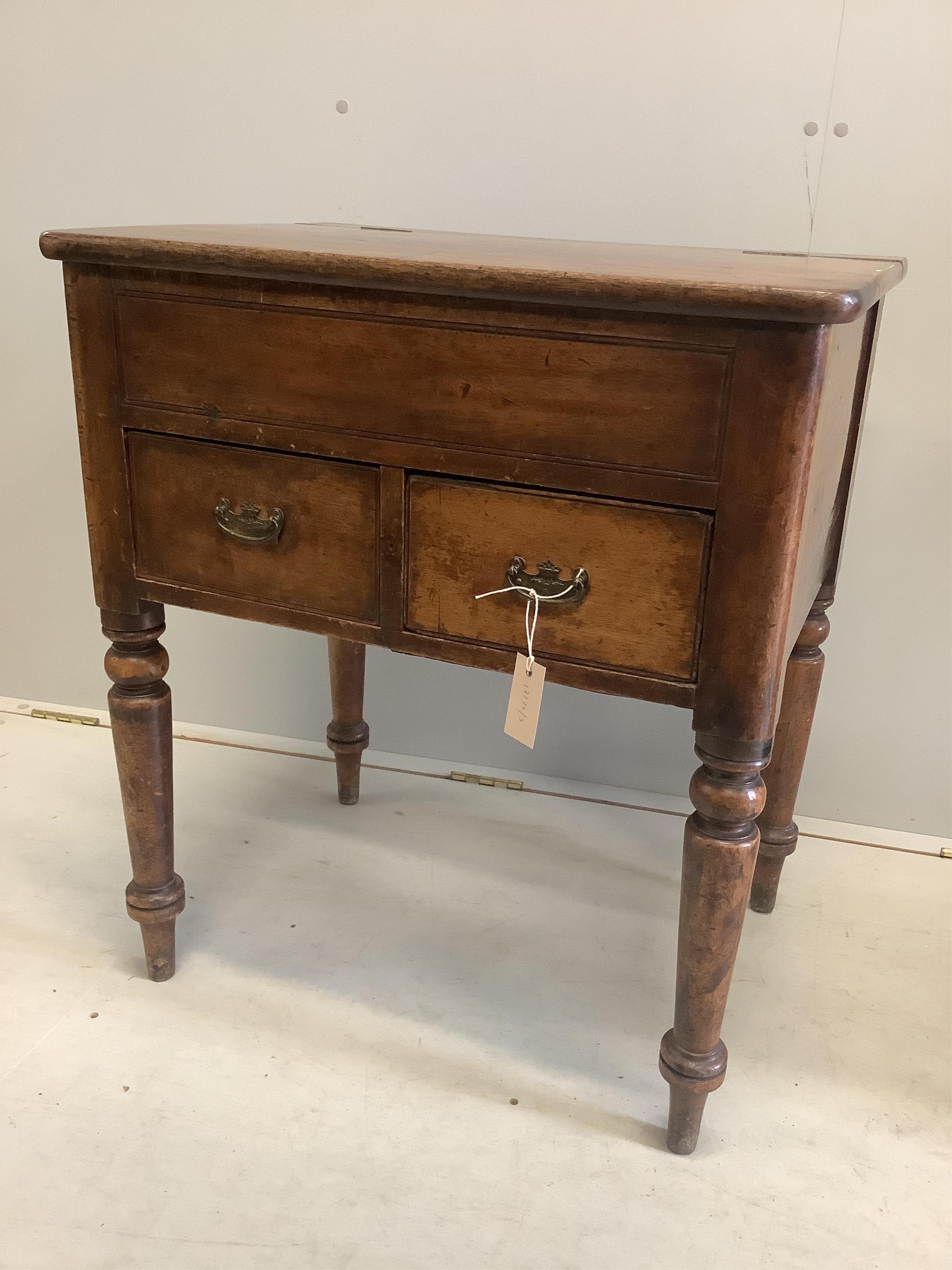 A Victorian mahogany two drawer hinged top washstand, width 66cm, depth 50cm, height 76cm. Condition - fair